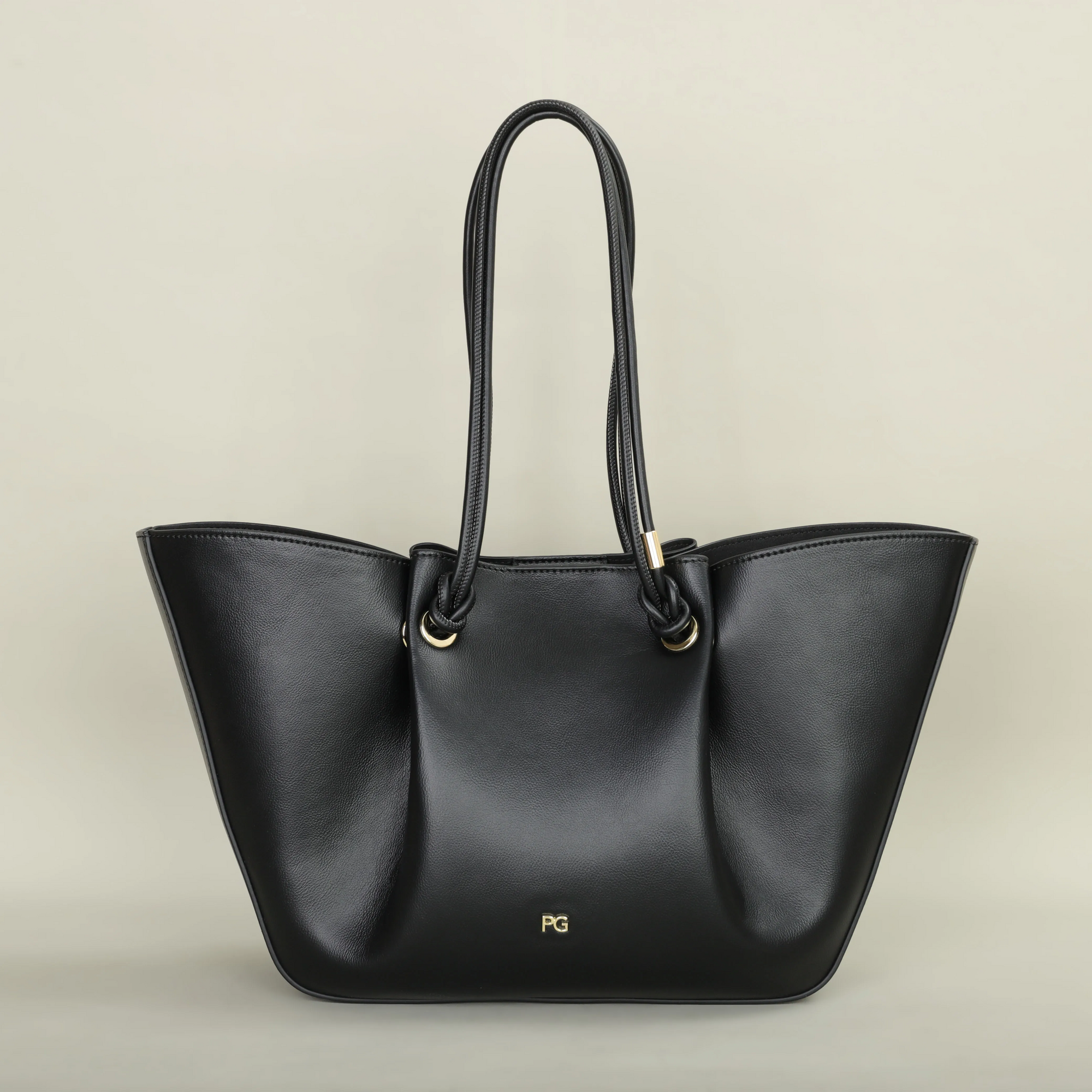 Pallier Grace structured leather tote bag with winged sides and knotted handles, lightweight carryall