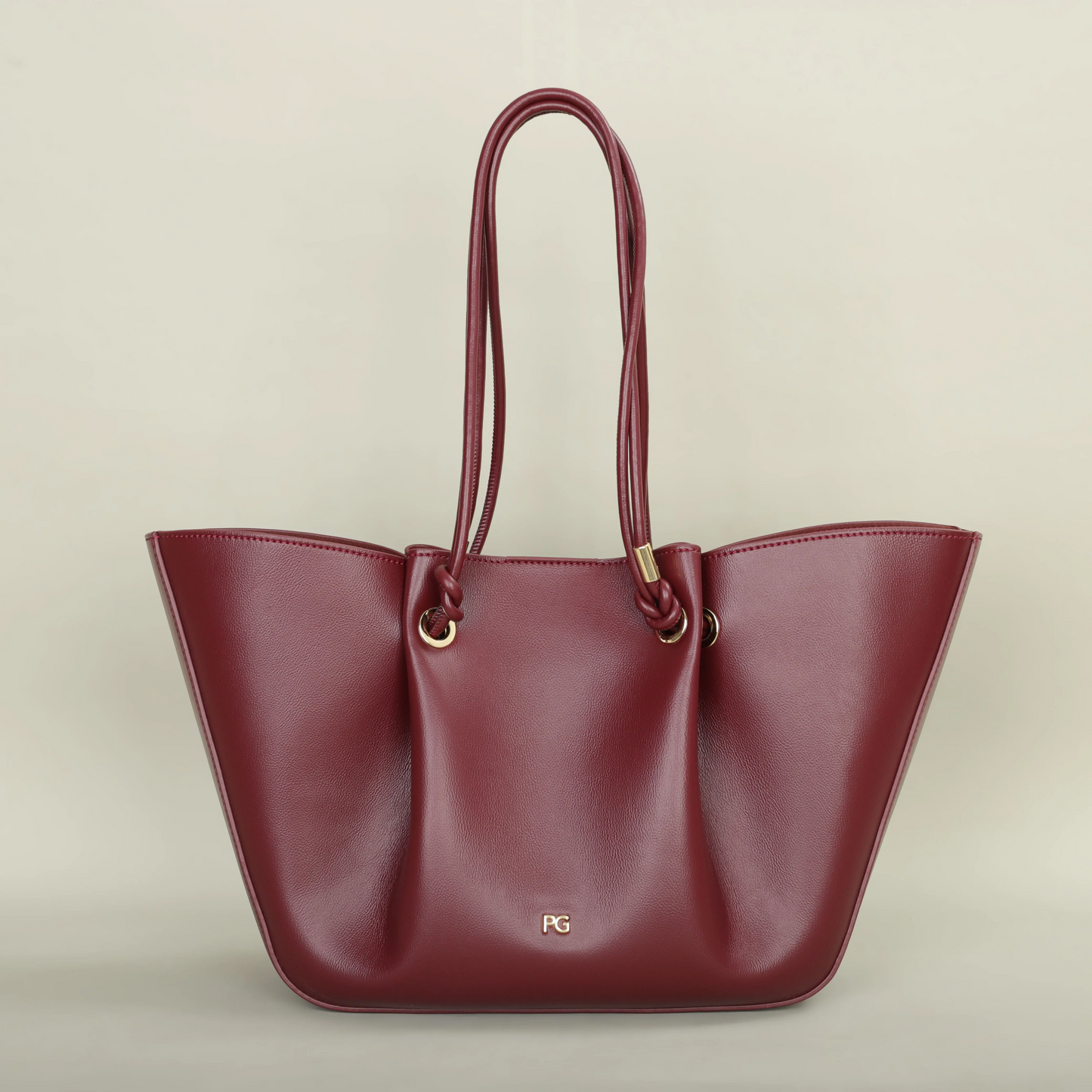 Pallier Grace structured leather tote bag with winged sides and knotted handles, lightweight carryall