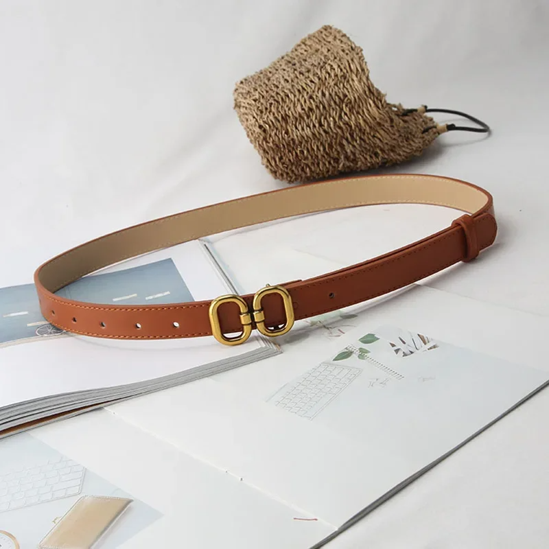 Black unisex vegan leather minimal belt with bold double brass buckle adjustable luxury finish