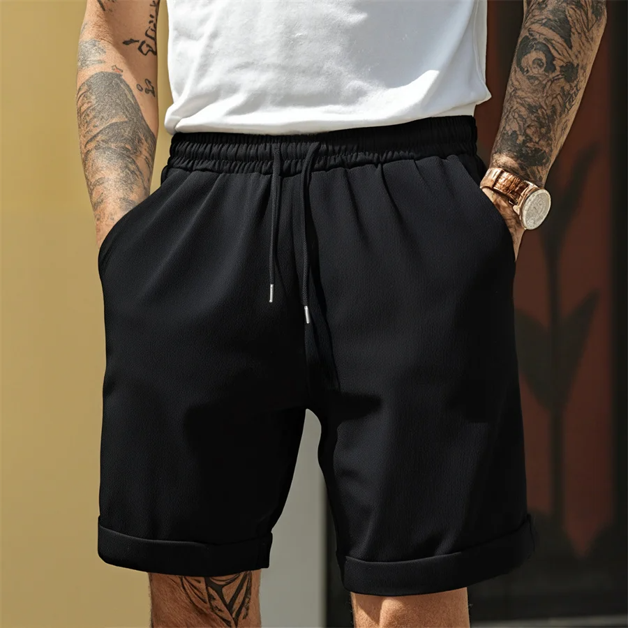 Men's taupe cuffed shorts lightweight textured fabric tapered silhouette elastic waistband drawstring