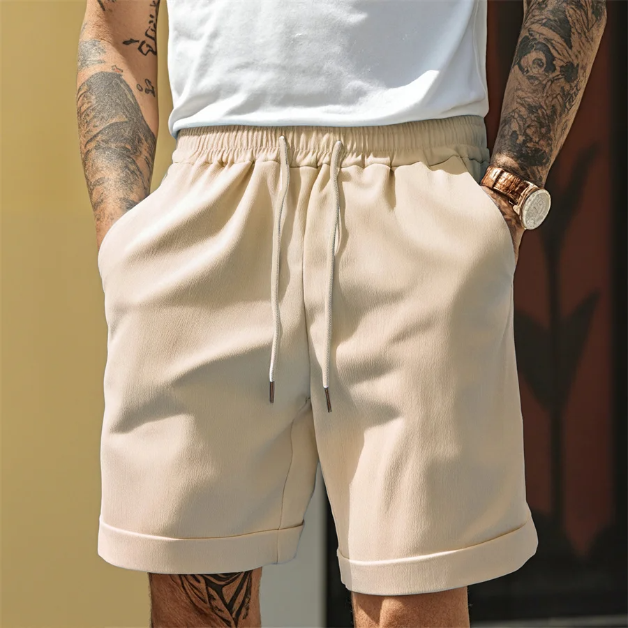 Men's taupe cuffed shorts lightweight textured fabric tapered silhouette elastic waistband drawstring