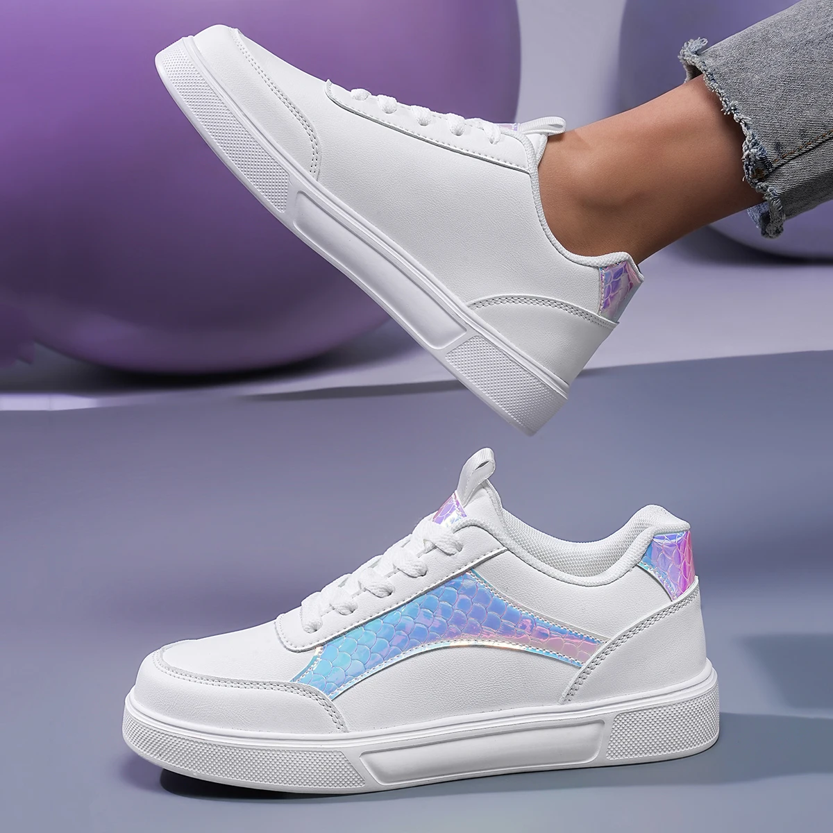 Women's chunky sole sneaker with shimmering silver accent panels and bold fashion-forward silhouette