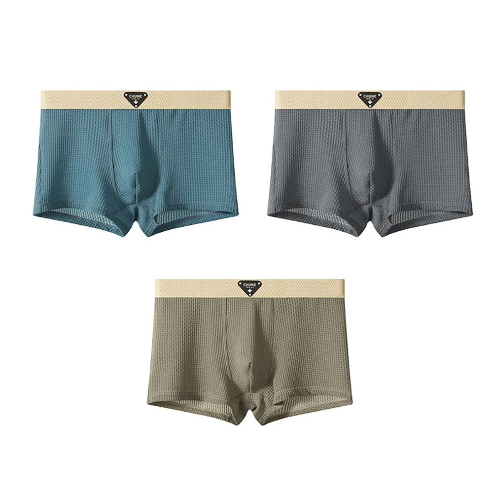 Men's fitted boxer briefs three-piece set in neutral tones with textured finish and logo waistband