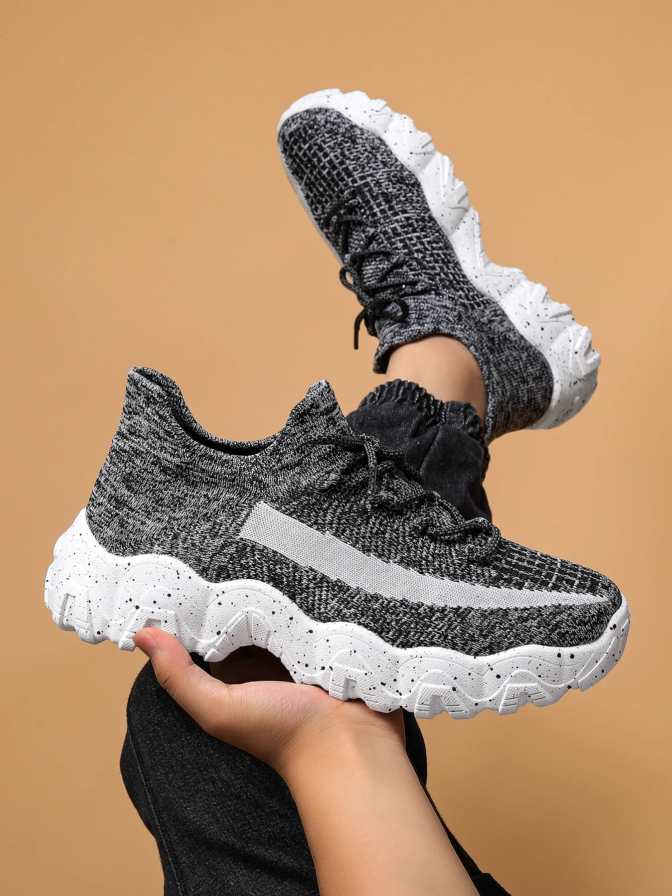 Black slip-on hybrid trainer sneakers with textured breathable knit upper and speckled cushioned grip sole
