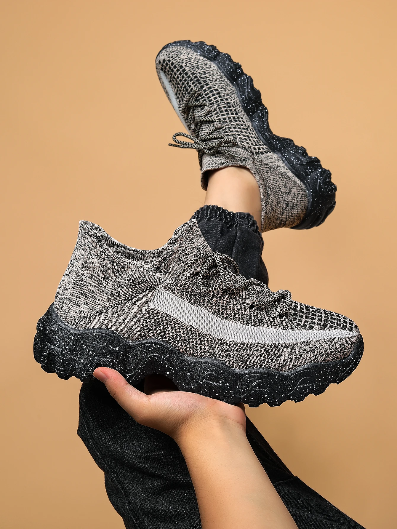 Black slip-on hybrid trainer sneakers with textured breathable knit upper and speckled cushioned grip sole