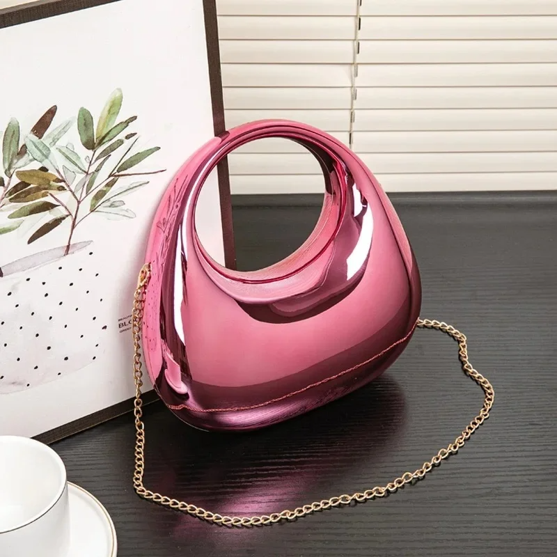 Nova sculptural clutch bag mirror-gloss acrylic finish sculpted silhouette wedding evening accessory