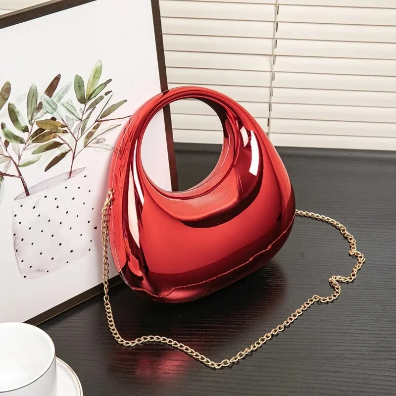 Nova sculptural clutch bag mirror-gloss finish sculpted silhouette wedding evening acrylic shell