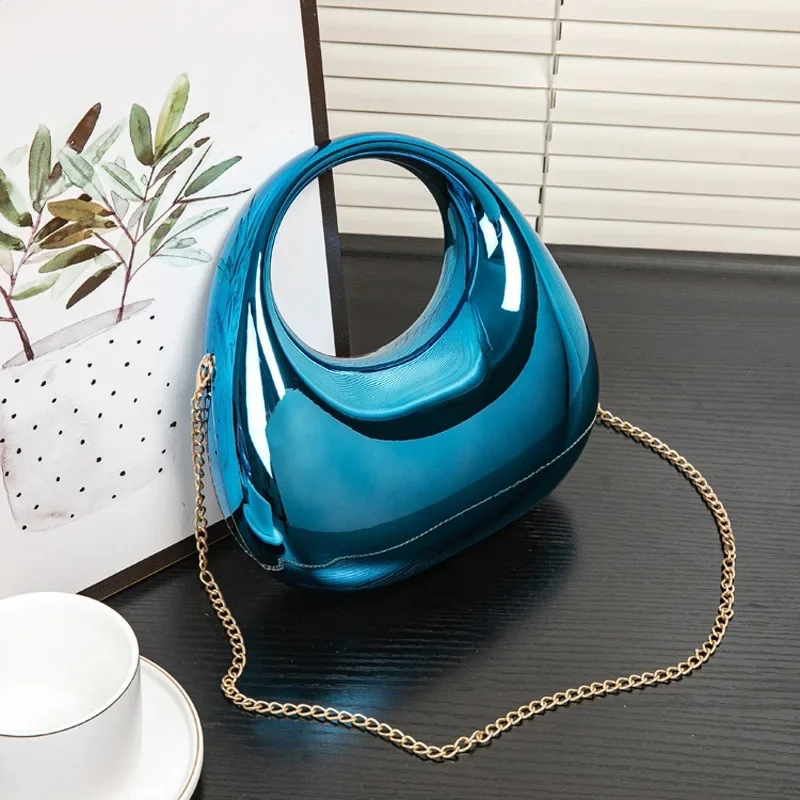 Nova sculptural clutch bag mirror-gloss finish sculpted silhouette evening wedding accessory