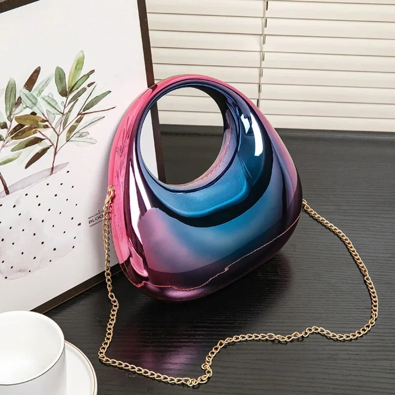 Nova sculptural clutch bag mirror gloss finish sculpted silhouette evening wedding accessory