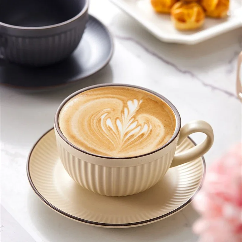 Emberware ribbed ceramic coffee mugs set with fluted texture, ergonomic handle, and stackable saucers
