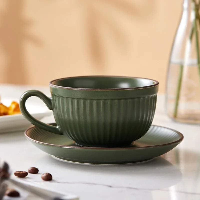 Emberware ribbed ceramic coffee mugs with fluted texture, ergonomic handle, and stackable saucers set