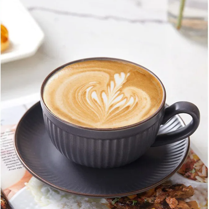 Emberware ribbed ceramic coffee mugs set with fluted texture, stackable saucers, and ergonomic curved handle
