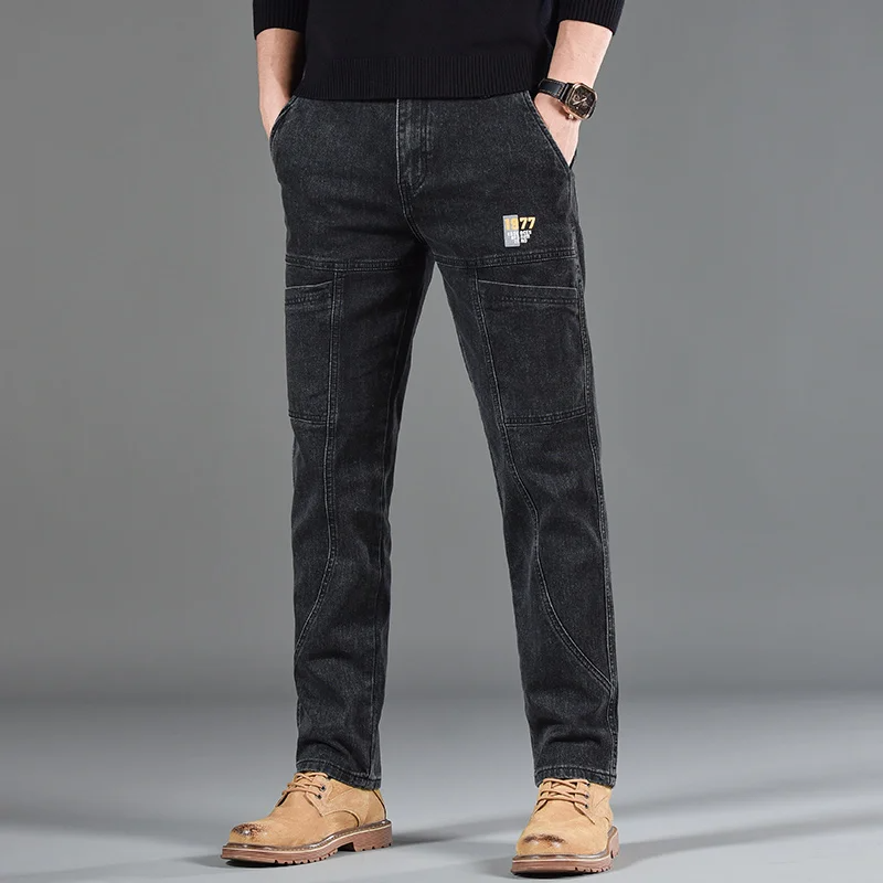 Dark indigo denim utility pants slim workwear fit with reinforced panels and multi-pocket design
