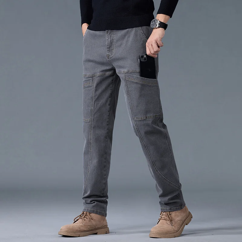 Dark wash denim utility pants slim workwear fit with reinforced panels and multi-pocket design