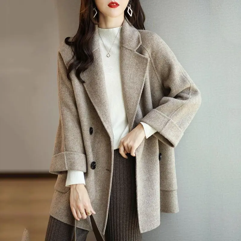 Women's slim fit double-breasted wool blend trench coat with tailored lapels for professional style