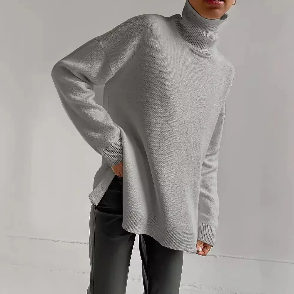 Women's oversized fine gauge knit turtleneck sweater, tunic-length silhouette with ribbed cuffs