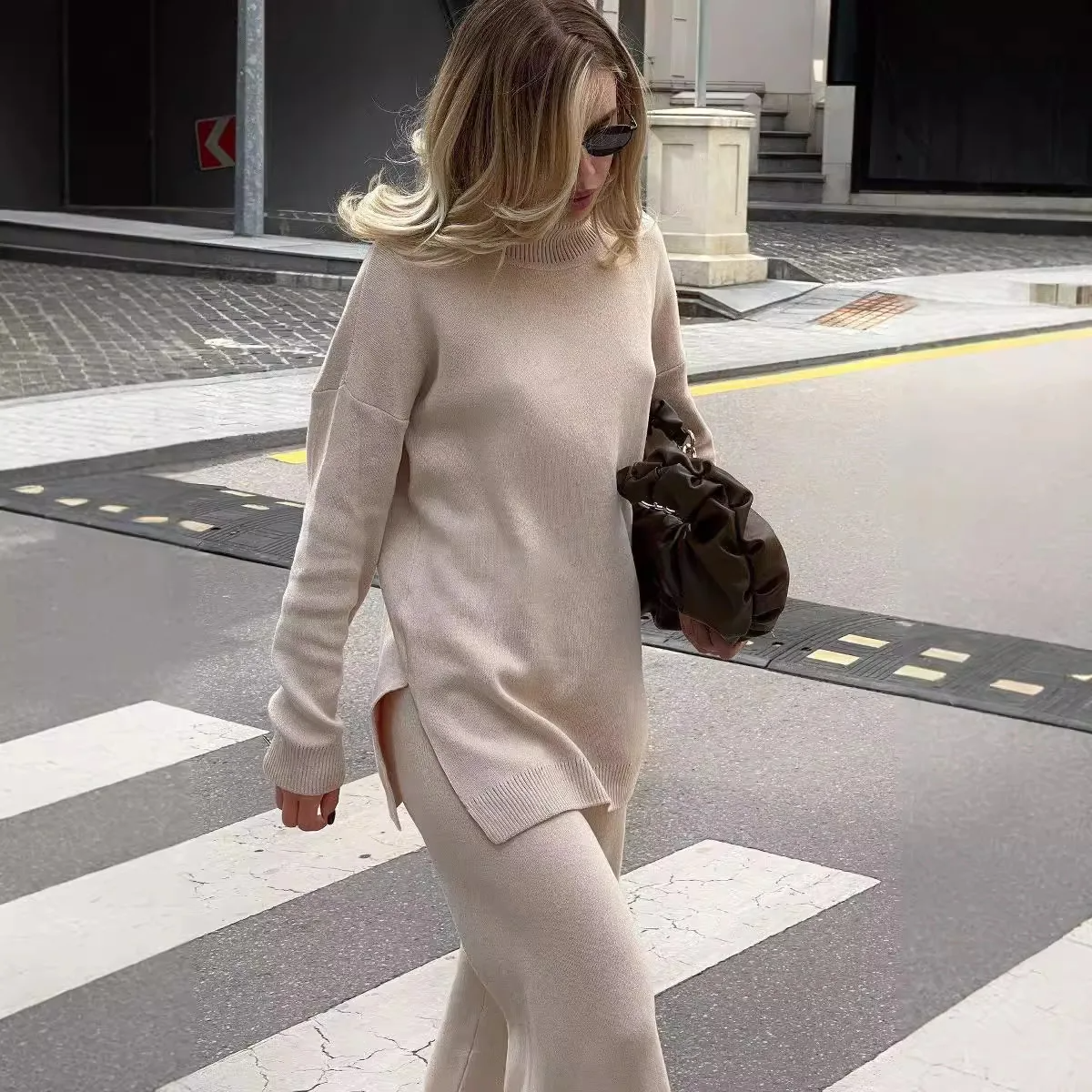 Women's oversized fine gauge knit turtleneck sweater, tunic-length silhouette with ribbed cuffs