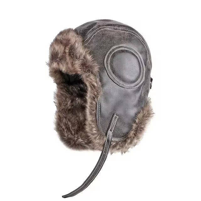Charcoal wool trapper hat with ear flaps, faux fur lining, and structured winter silhouette for outdoor use