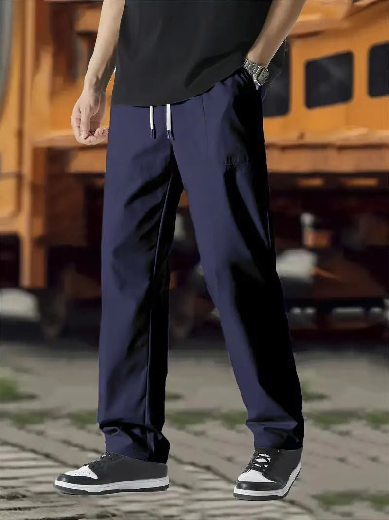 Men's gray modern-fit jogger track pants with elastic drawstring waist and flexible comfortable fabric