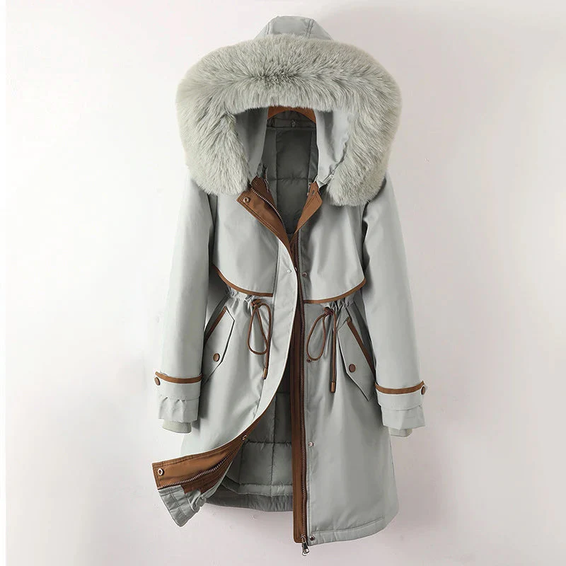 Women's tailored parka jacket with fur trim hood, quilted lining, zip closure, sleek winter fit