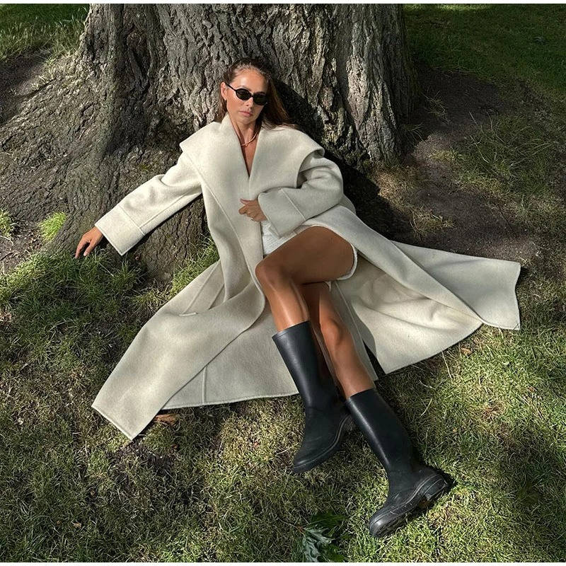 Women's double-breasted wool overcoat with lace-up detail, tailored fit, elegant winter style