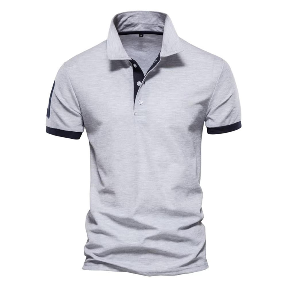 Men's navy slim fit polo shirt with contrast orange placket and cuffs, smart casual style