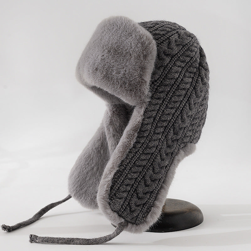 Beige cable knit trapper hat faux fur trim ear flaps braided tie straps women winter