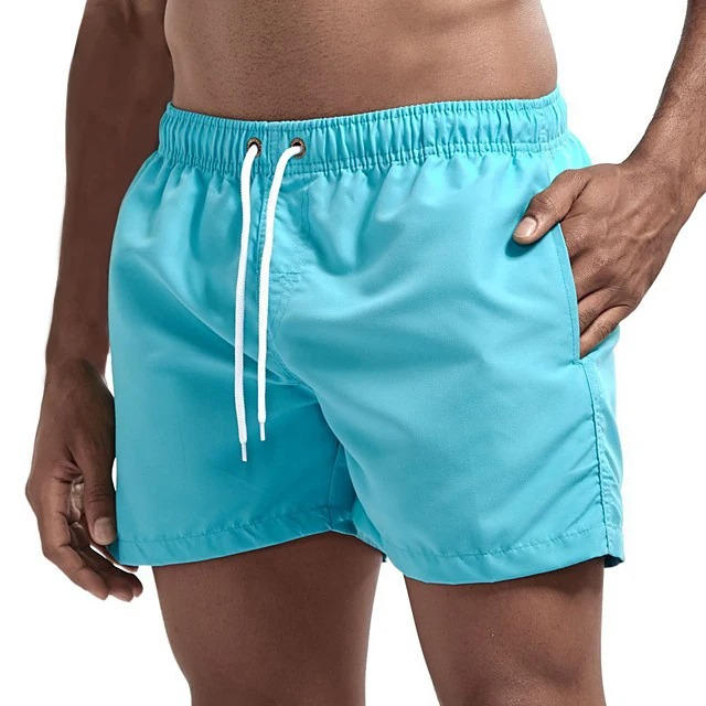 Men's gray quick-dry swim trunks with drawstring waist, comfort fit design for beach and active use