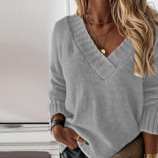 Women's oversized V-neck knit sweater in soft acrylic wool blend with ribbed cuffs for cozy everyday style