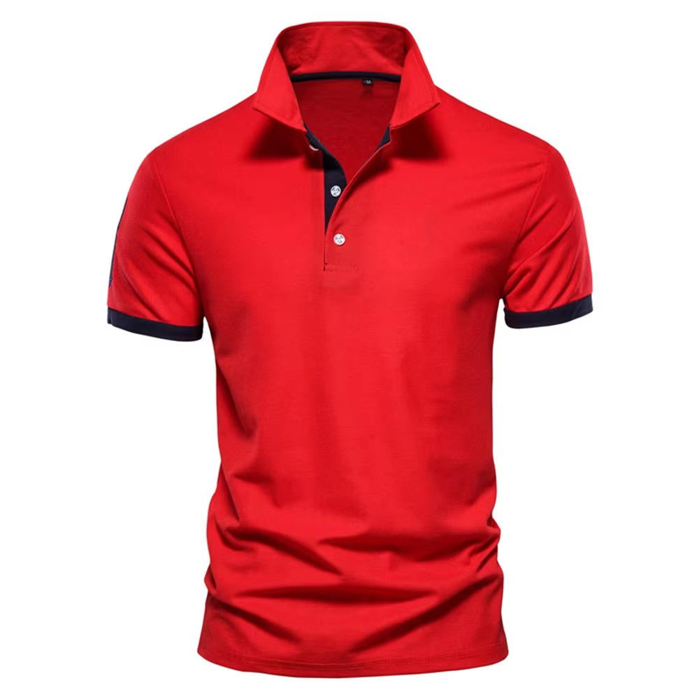 Men's navy slim fit polo shirt with bold orange contrast placket and cuffs, smart casual style