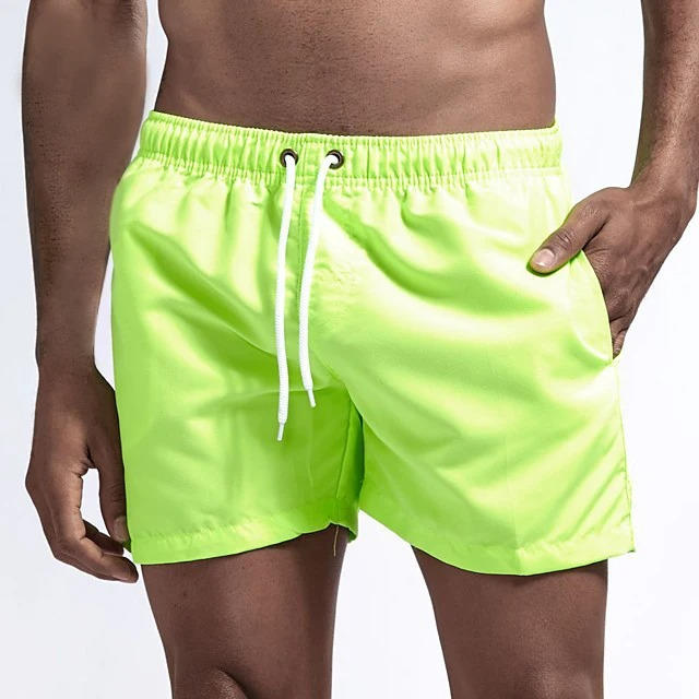Men's gray quick-dry swim trunks with drawstring waist, comfort fit design built for beach and active wear
