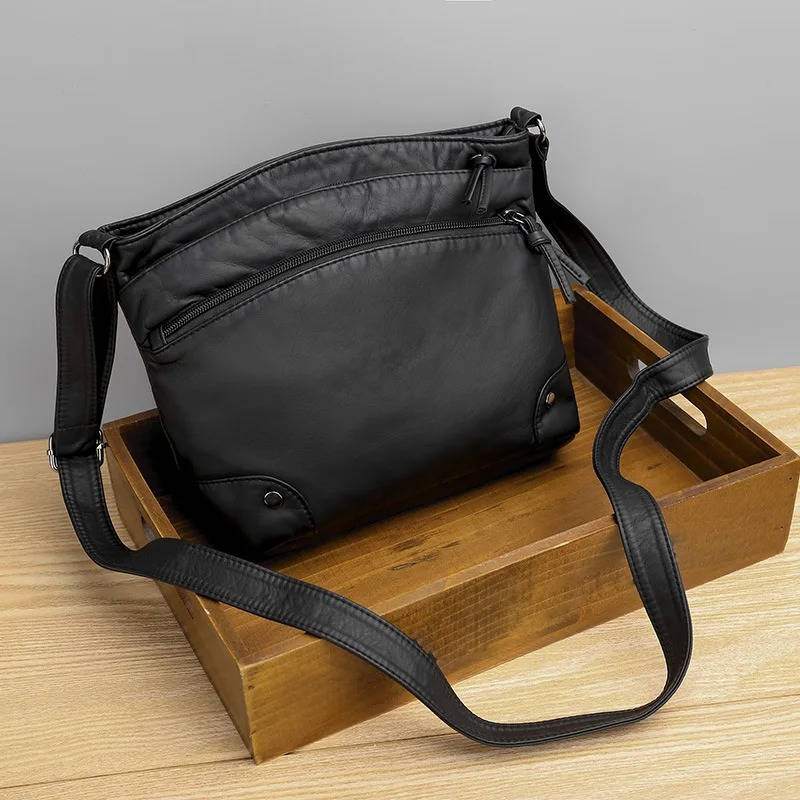 Women's brown leather crossbody bag with seven-pocket organization for hands-free everyday carry