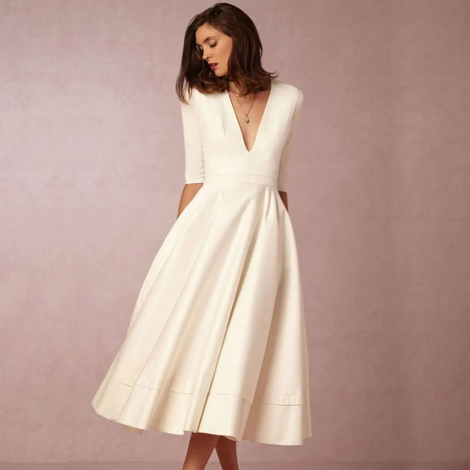 Women's elegant deep V-neck dress flattering fit versatile day-to-night style for special occasions