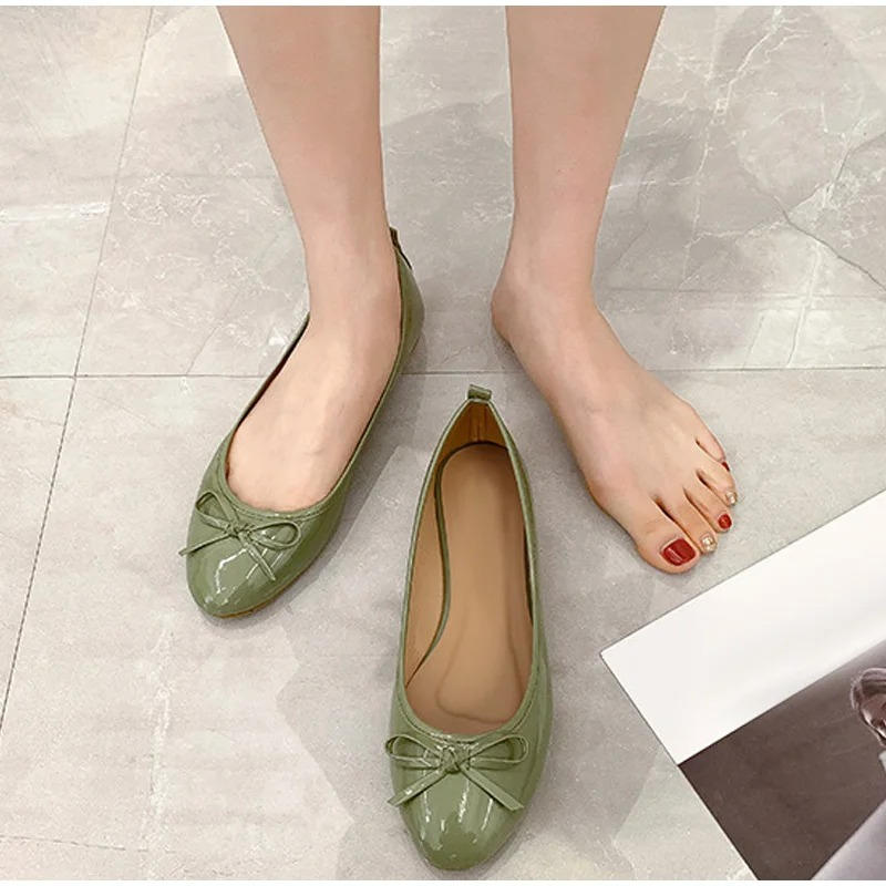 Beige leather ballet flats with arch support, polished round-toe silhouette for all-day office wear