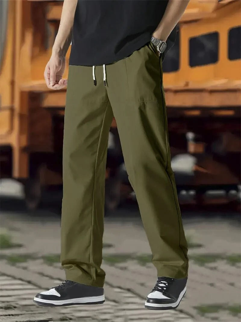 Men's gray modern-fit jogger track pants with drawstring waist and flexible premium fabric