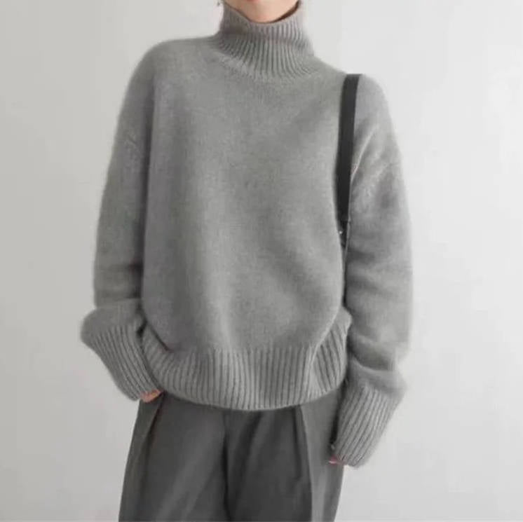 Women's oversized cashmere turtleneck sweater soft lightweight relaxed silhouette everyday luxury