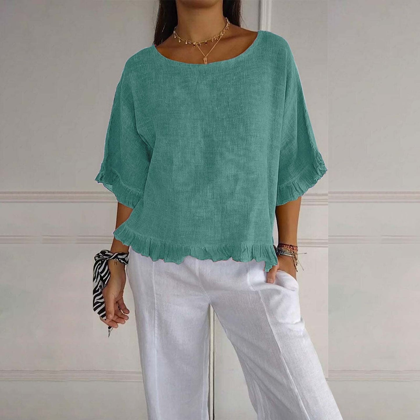 Women's loose fit blouse with delicate ruffle cuffs and hem, airy silhouette for effortless layering