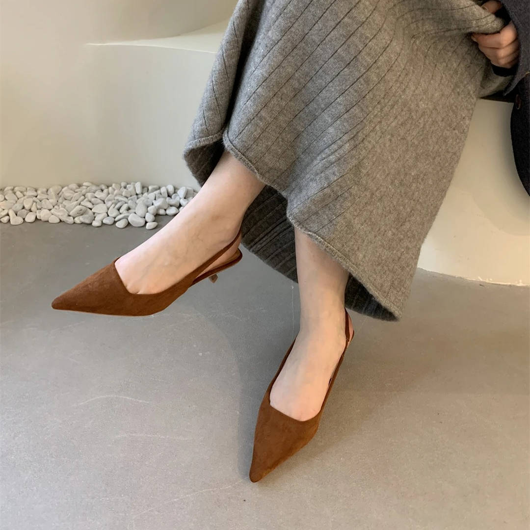 Women's pointed toe slingback kitten heels in polished finish with adjustable strap for all-day comfort