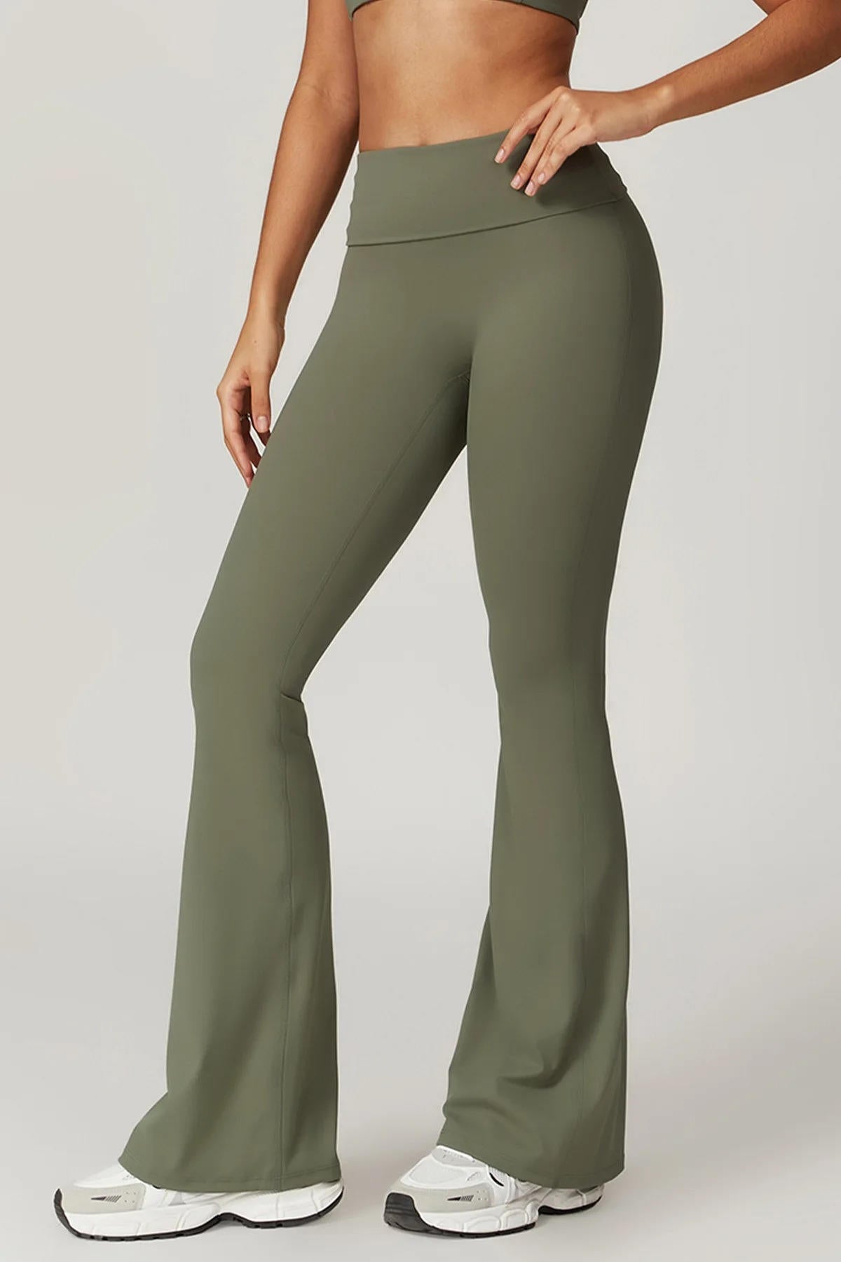 Women's black high-waisted yoga pants with tummy control, flattering silhouette and secure fit