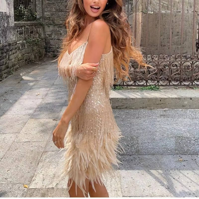 White sleeveless mini cocktail dress with fringe body and feather hem, body-conscious fit