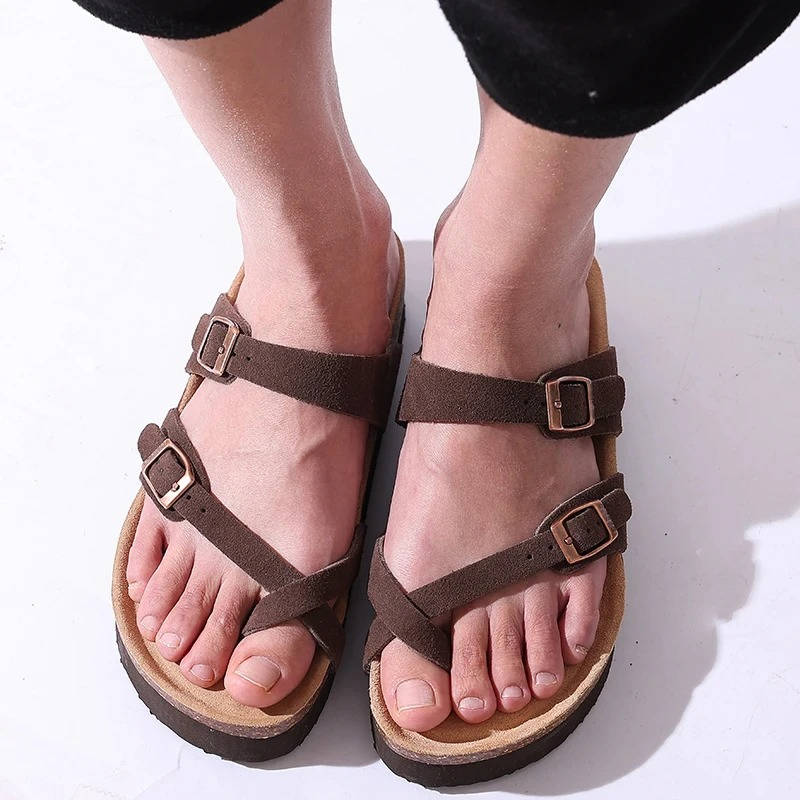 Neutral cork footbed sandals with double buckle straps, supportive arch cushioning unisex style