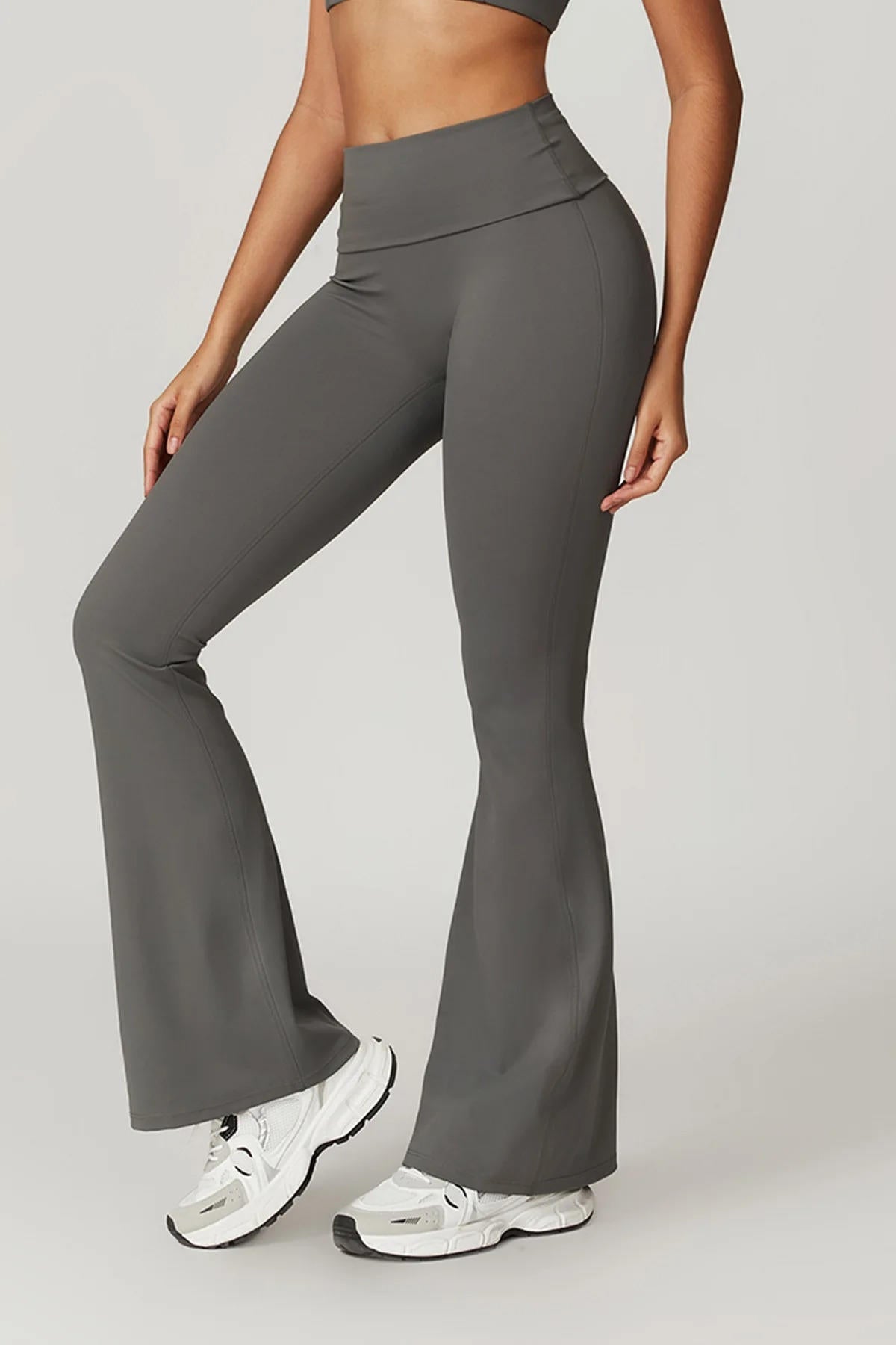 Women's black high-waisted yoga pants with tummy control, flattering silhouette and secure fit