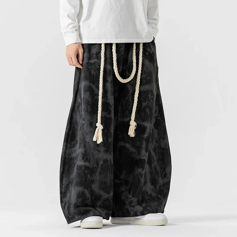 Tie-dye wide leg cotton blend trousers with rope accents in bold streetwear silhouette