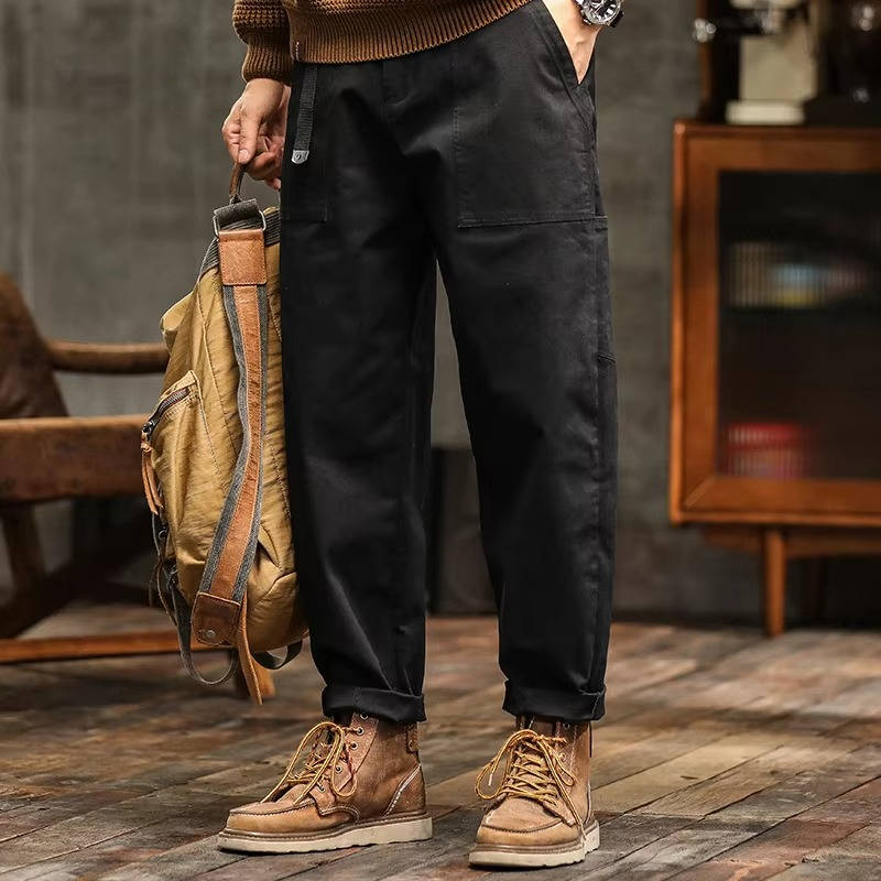 Men's relaxed fit cargo work pants in neutral tones with deep utility pockets for jobsite mobility