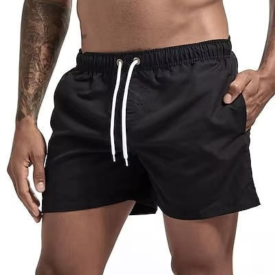 Men's gray quick-dry swim trunks with drawstring waist, comfort fit design for beach and active use