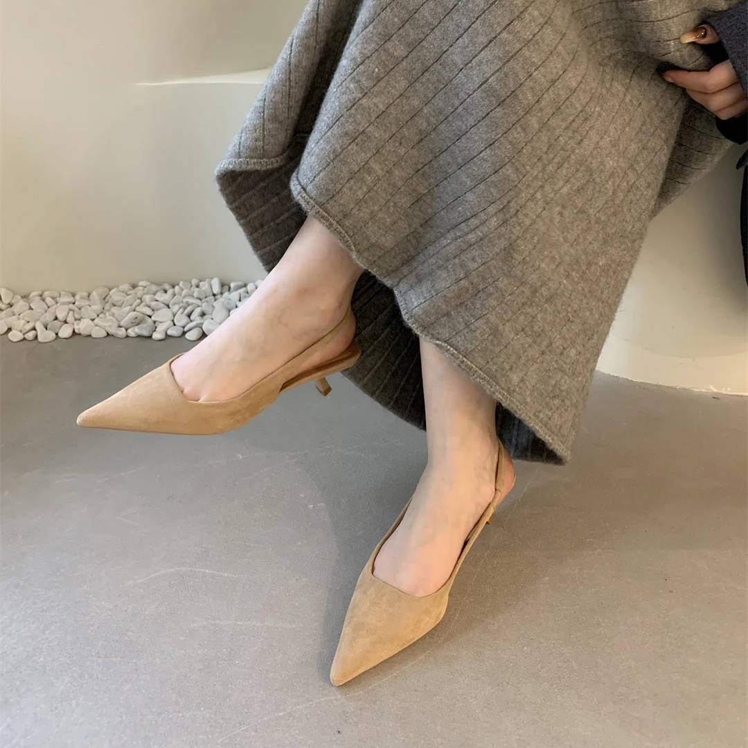 Women's pointed toe slingback kitten heels in polished finish with adjustable strap for all-day comfort