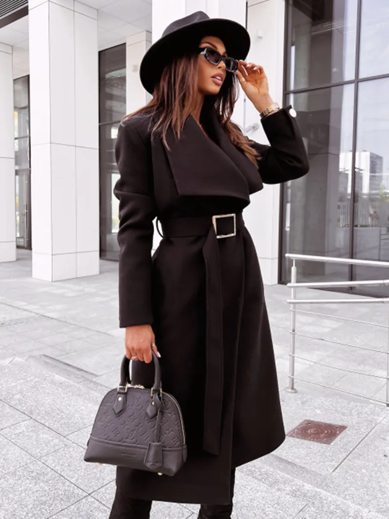 Women's long tailored coat with belt buckle and button closure, elegant chic silhouette outerwear