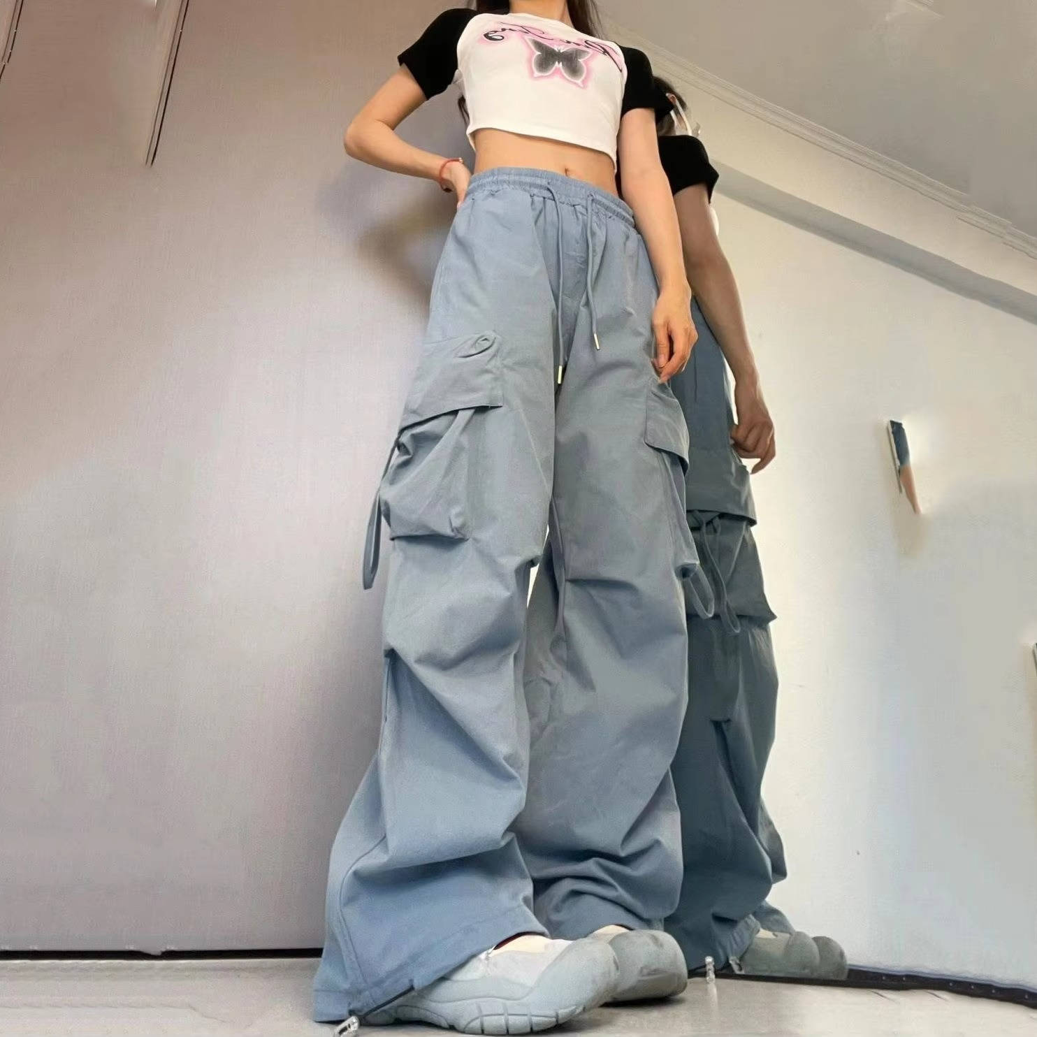 Women's loose fit cargo trousers in neutral tones, baggy silhouette with deep side pockets