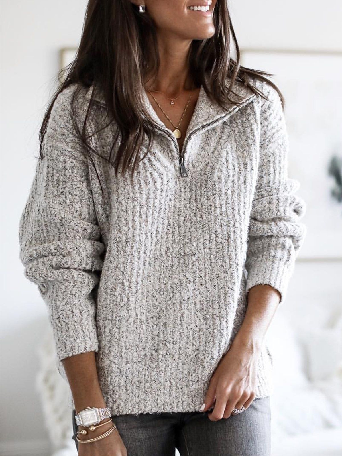 Women's beige zip-up ribbed sweater with cozy feel, relaxed fit, and textured dimensional detail