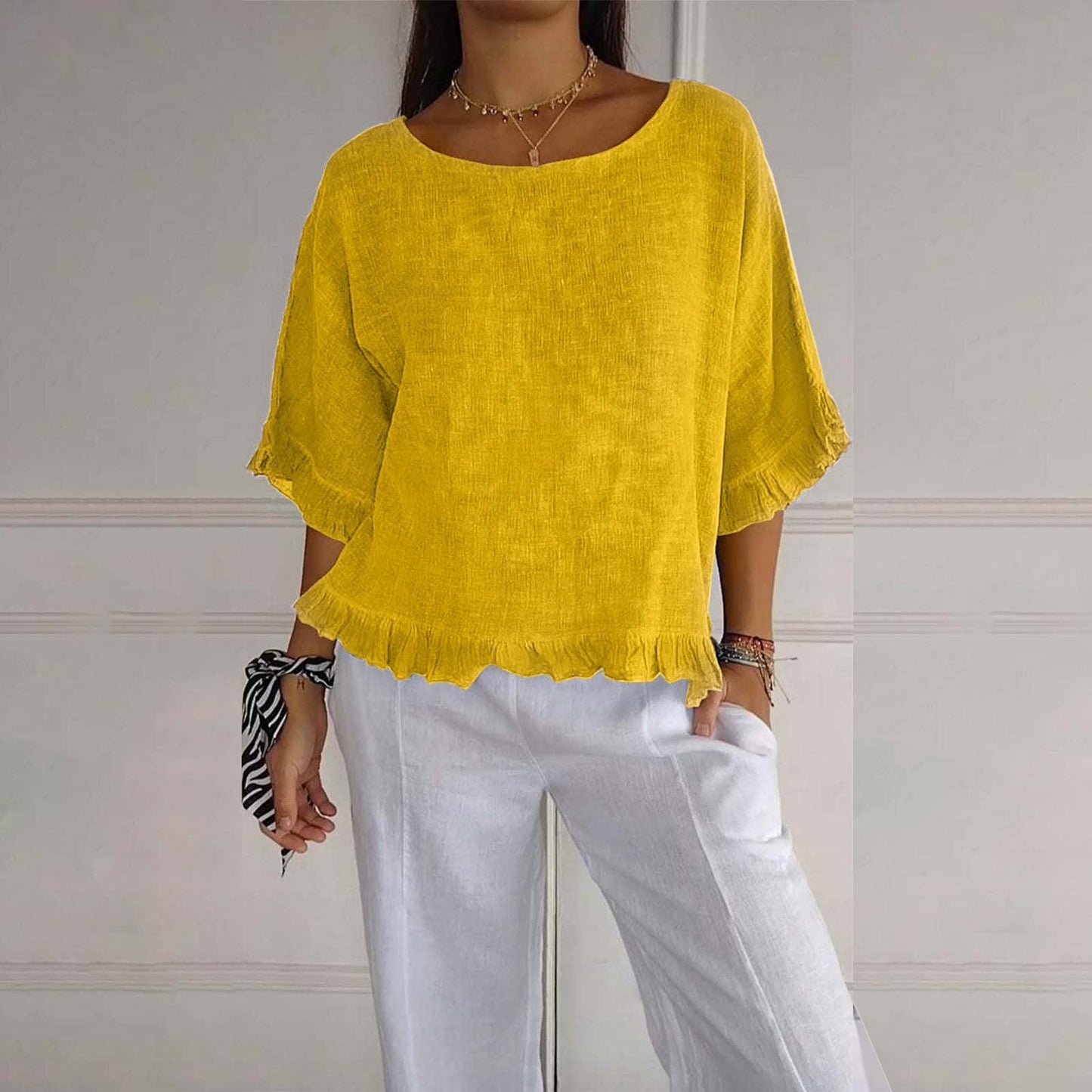 Women's loose fit ruffle blouse, airy silhouette with delicate frills at cuffs and hem for easy layering